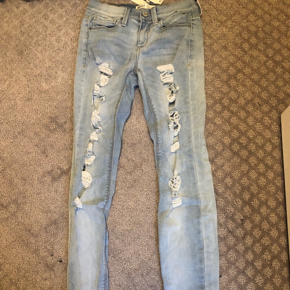 Ripped light wash jeans perfect condition.